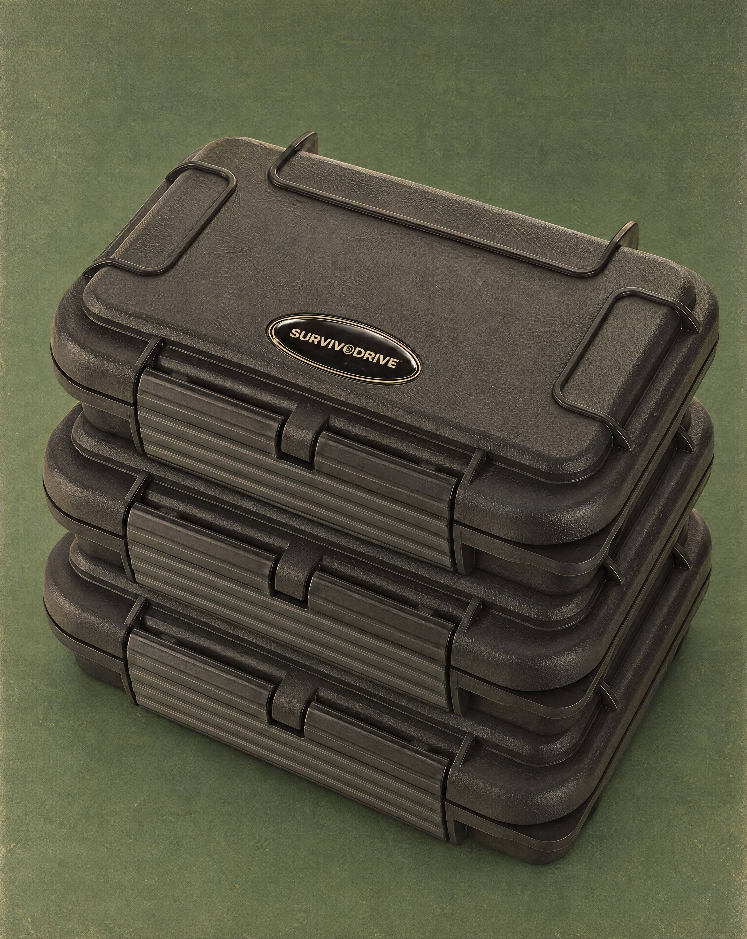 Three SURVIVODRIVE cases stacked on a deep green backdrop